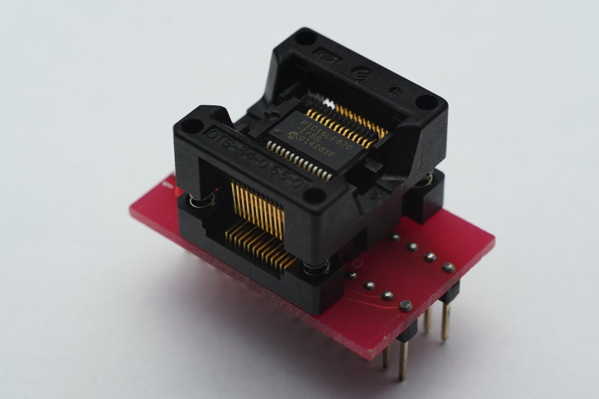 A SOIC-packaged microcontroller in a programming socket — generic SOIC reference. The 74LVC1T45 is a smaller SC-70-6 or SOT-23-6, but the SOIC-class reference gives the visual scale for the surface…