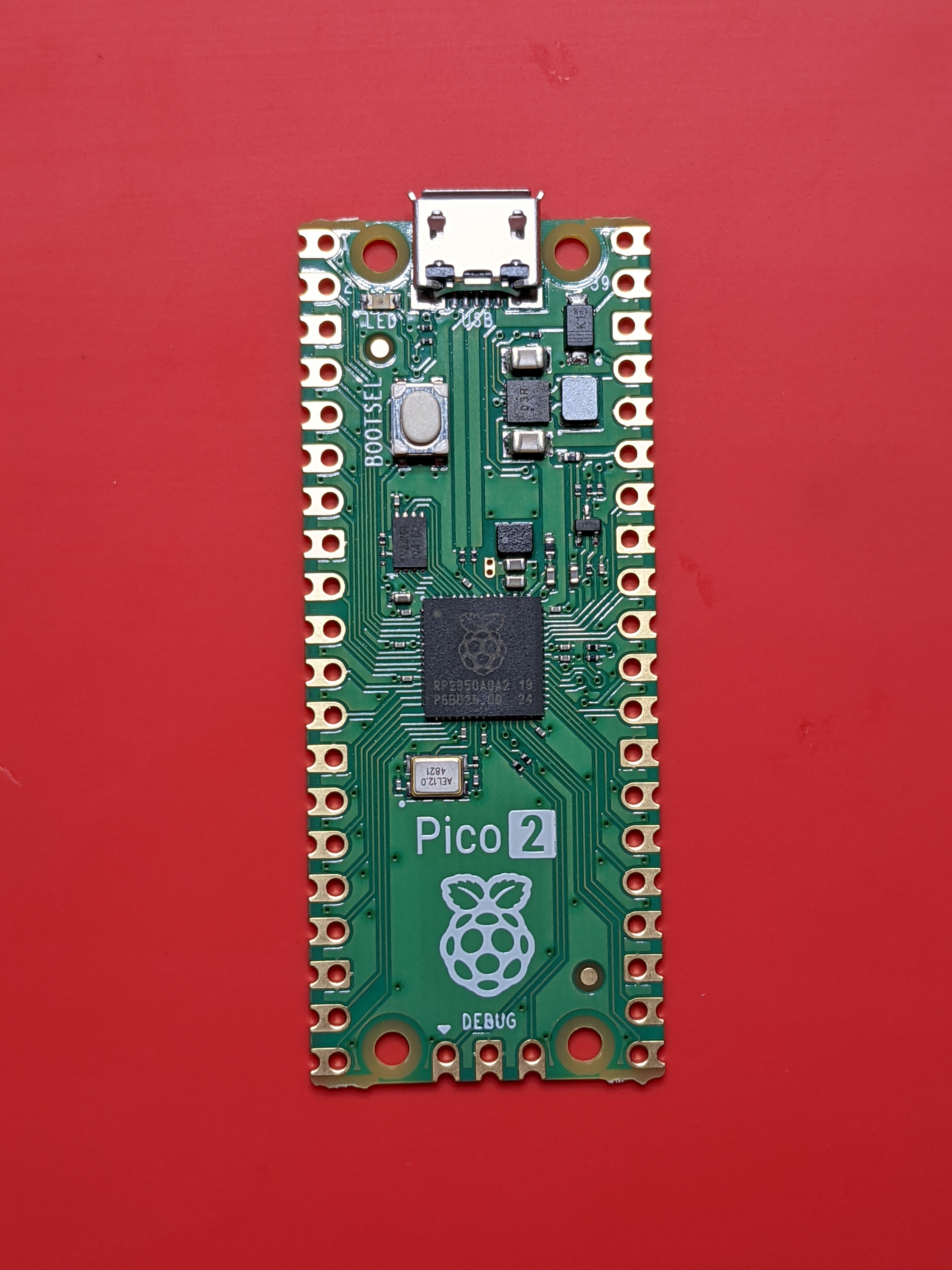 Raspberry Pi Pico 2 (RP2350), top view. Same physical footprint as the original Pico, with the RP2350 SoC under the silkscreened logo.