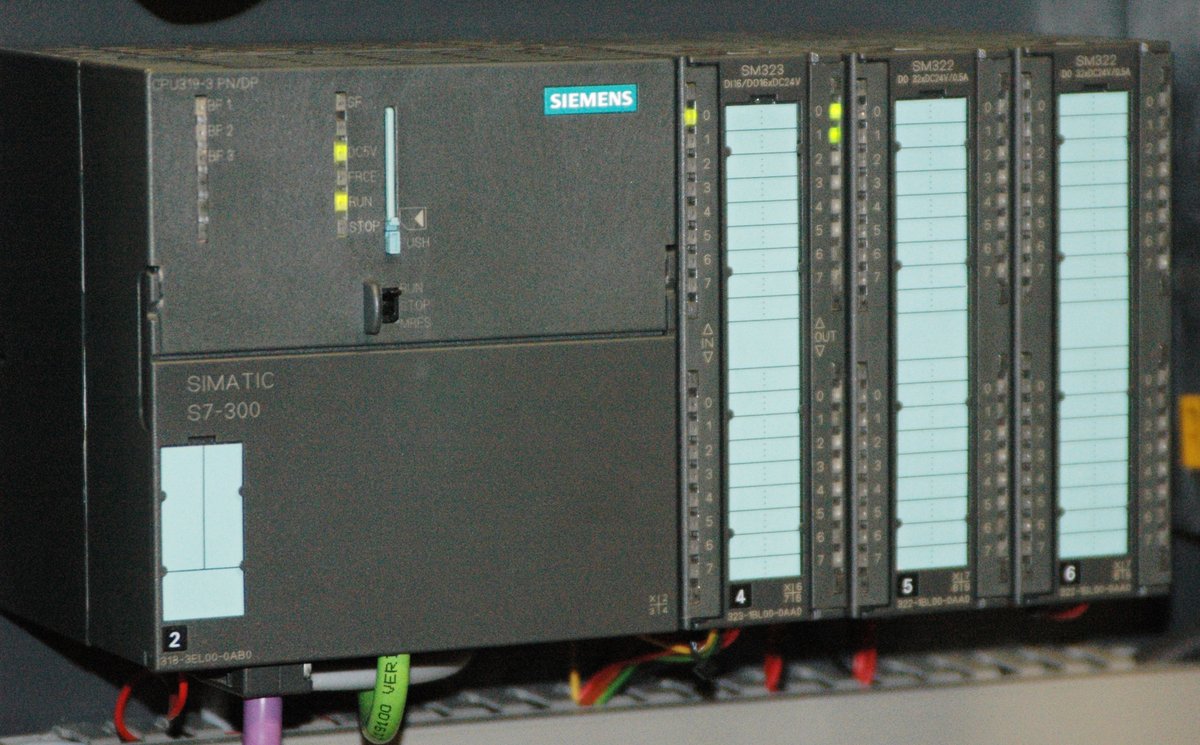 A Siemens SIMATIC S7-300 programmable logic controller — the precise hardware family Stuxnet was engineered to compromise. The S7-300 series uses the MPI (Multi-Point Interface) and Profibus protoc…